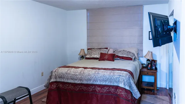 a bedroom with a bed and a chair