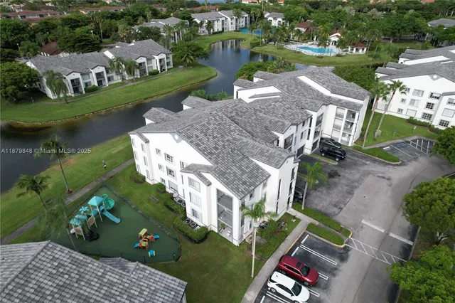 an aerial view of a house with outdoor space lake view and lake view