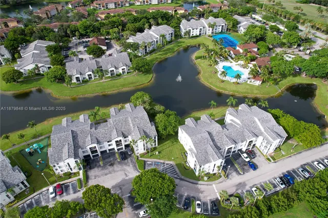 an aerial view of a house with yard swimming pool and outdoor seating
