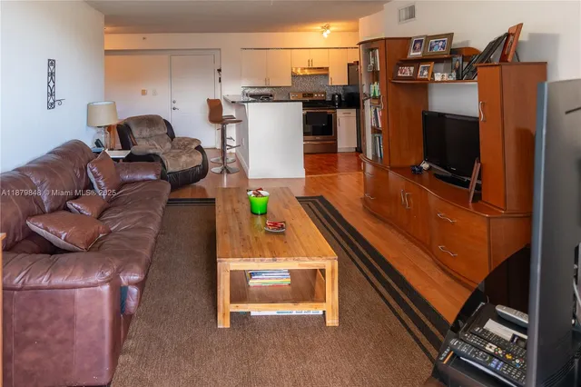 a room with furniture and a flat screen tv