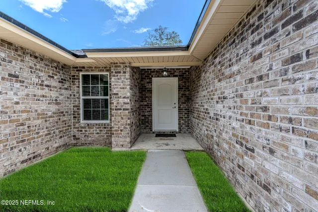 a view of a pathway with a house