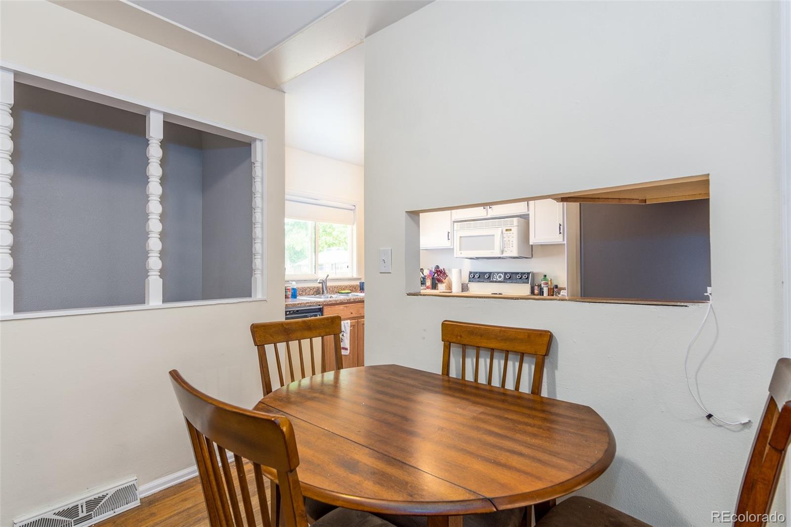 4865 Garrison Street Wheat Ridge, CO 80033 - Photo 13 of 40 a view of a dining room with furniture