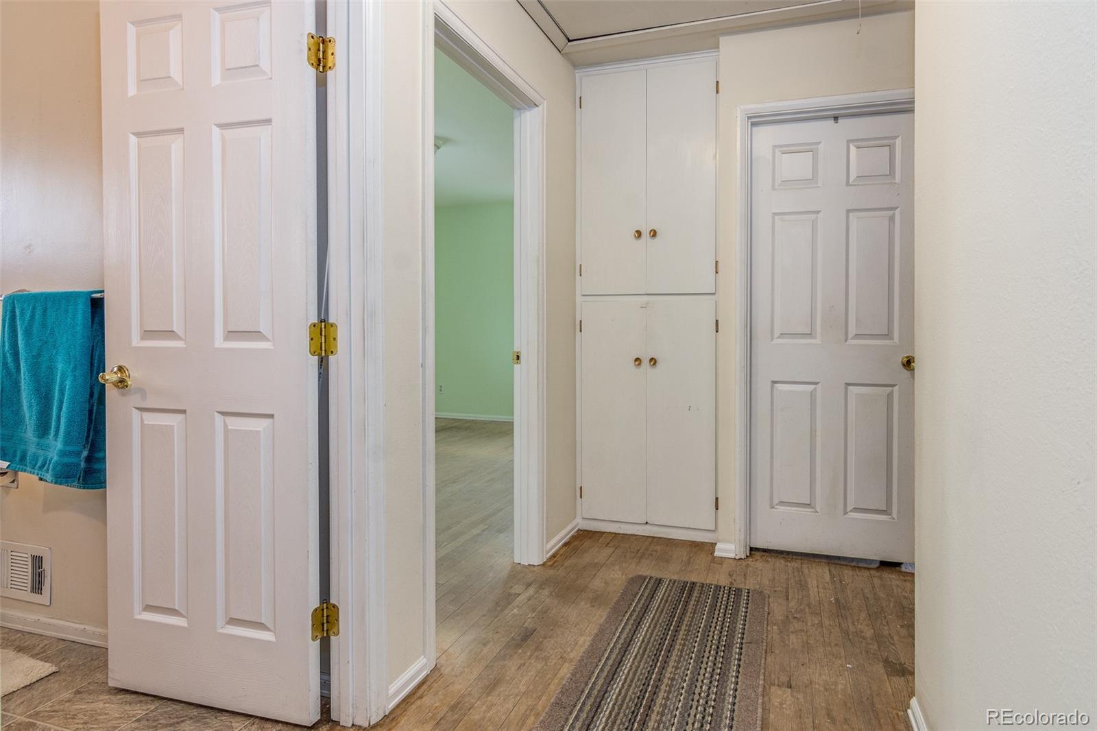 4865 Garrison Street Wheat Ridge, CO 80033 - Photo 8 of 40 a view of an empty room with wooden floor