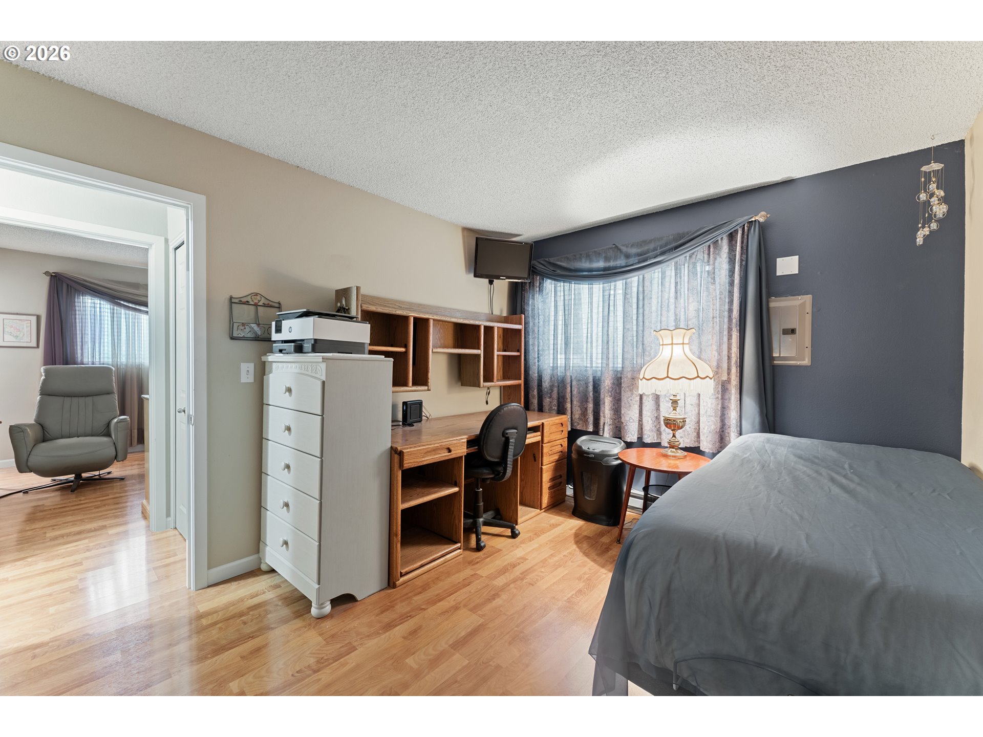 11341 Southwest Springwood Drive Portland, OR 97223 - Photo 21 of 26 a bedroom with furniture and large windows