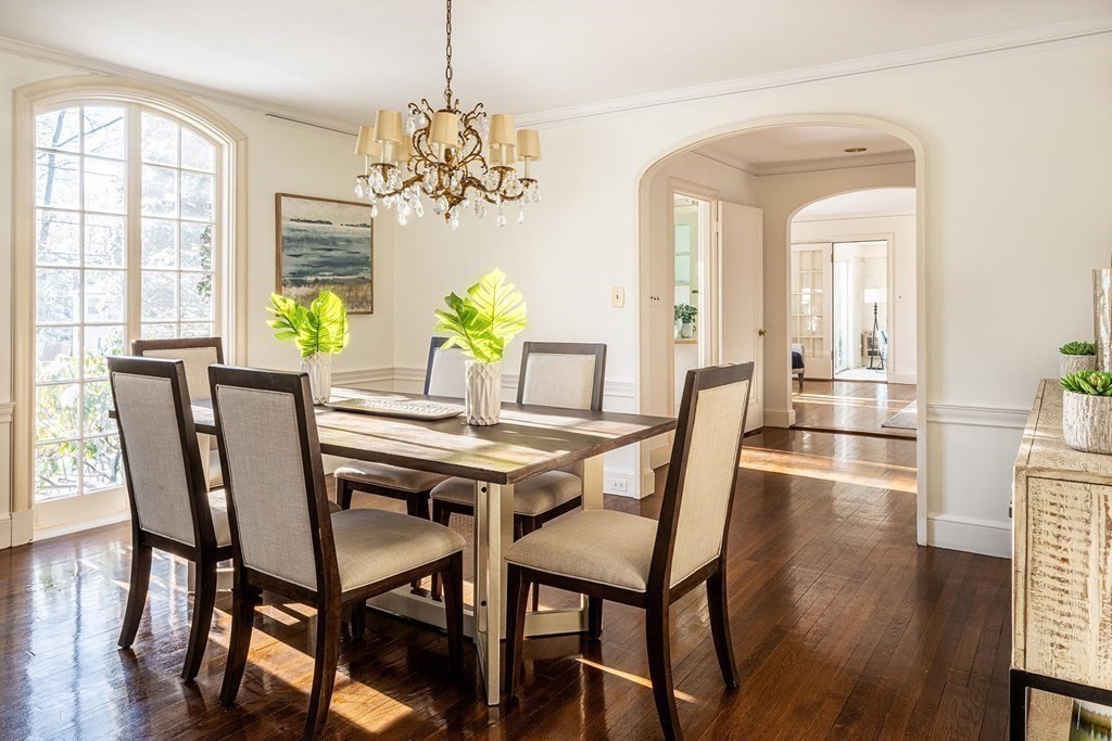 111 Hammondswood Road Newton, MA 02467 - Photo 5 of 15 a dining room with furniture a chandelier and wooden floor