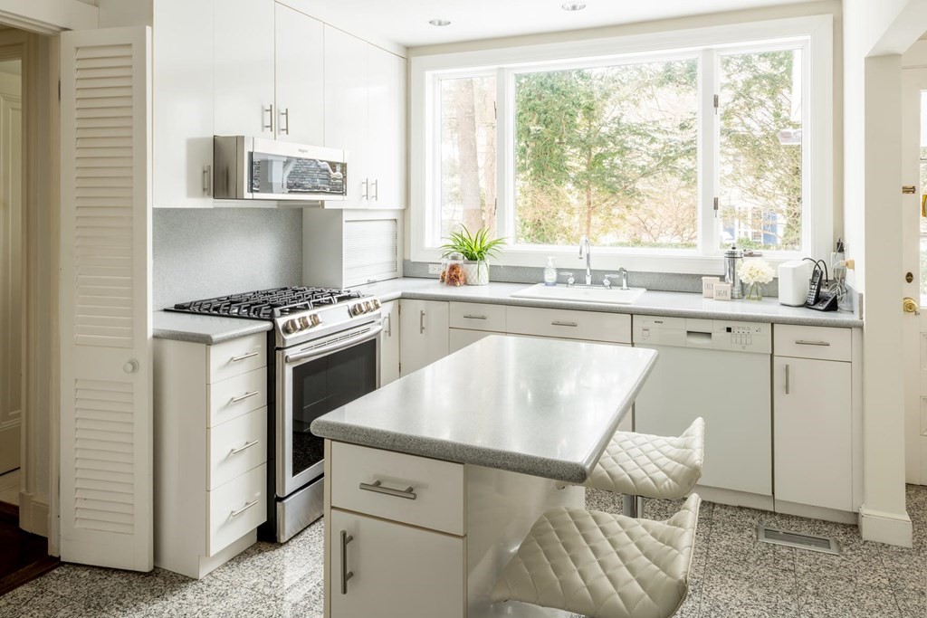 111 Hammondswood Road Newton, MA 02467 - Photo 8 of 15 a kitchen with a stove a sink and cabinets
