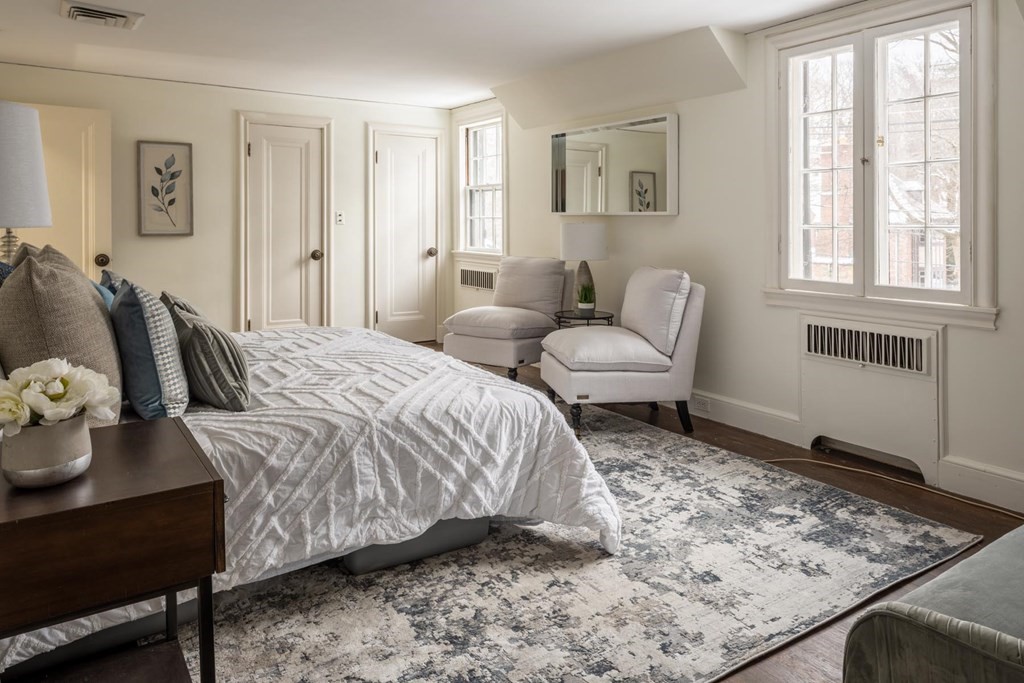 111 Hammondswood Road Newton, MA 02467 - Photo 10 of 15 a bedroom with a bed and wooden floor