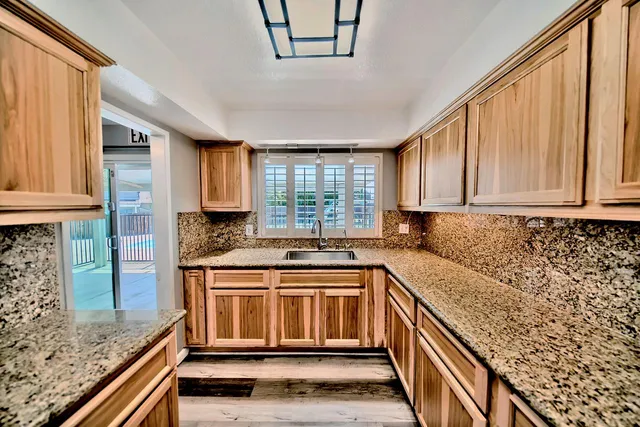 a kitchen with a stove and a sink