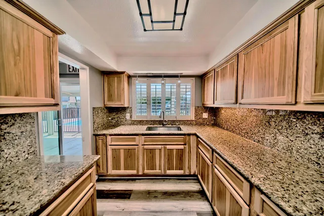 a kitchen with a stove and a sink