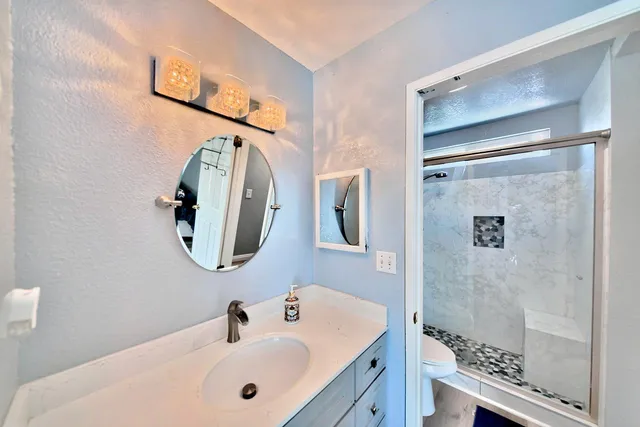 a bathroom with a sink and mirror