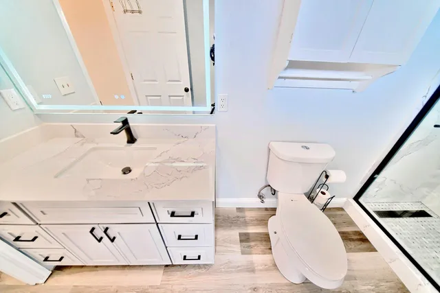 a bathroom with a sink and a mirror