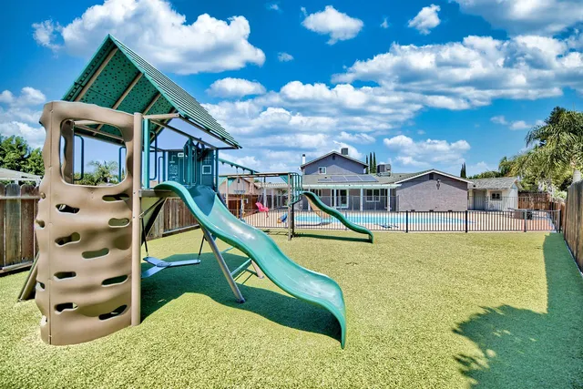 a view of a house with a swimming pool