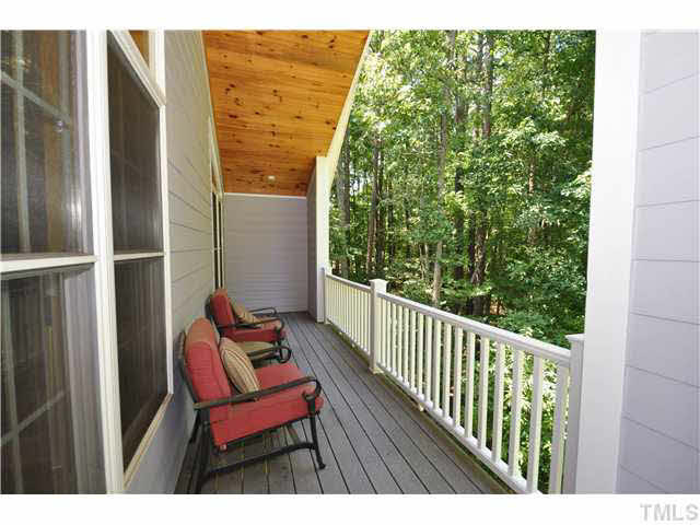 4209 White Chapel Way Raleigh, NC 27615 - Photo 19 of 25 The deck off of the detached garage offers views into the park like backyard! Patio/Deck