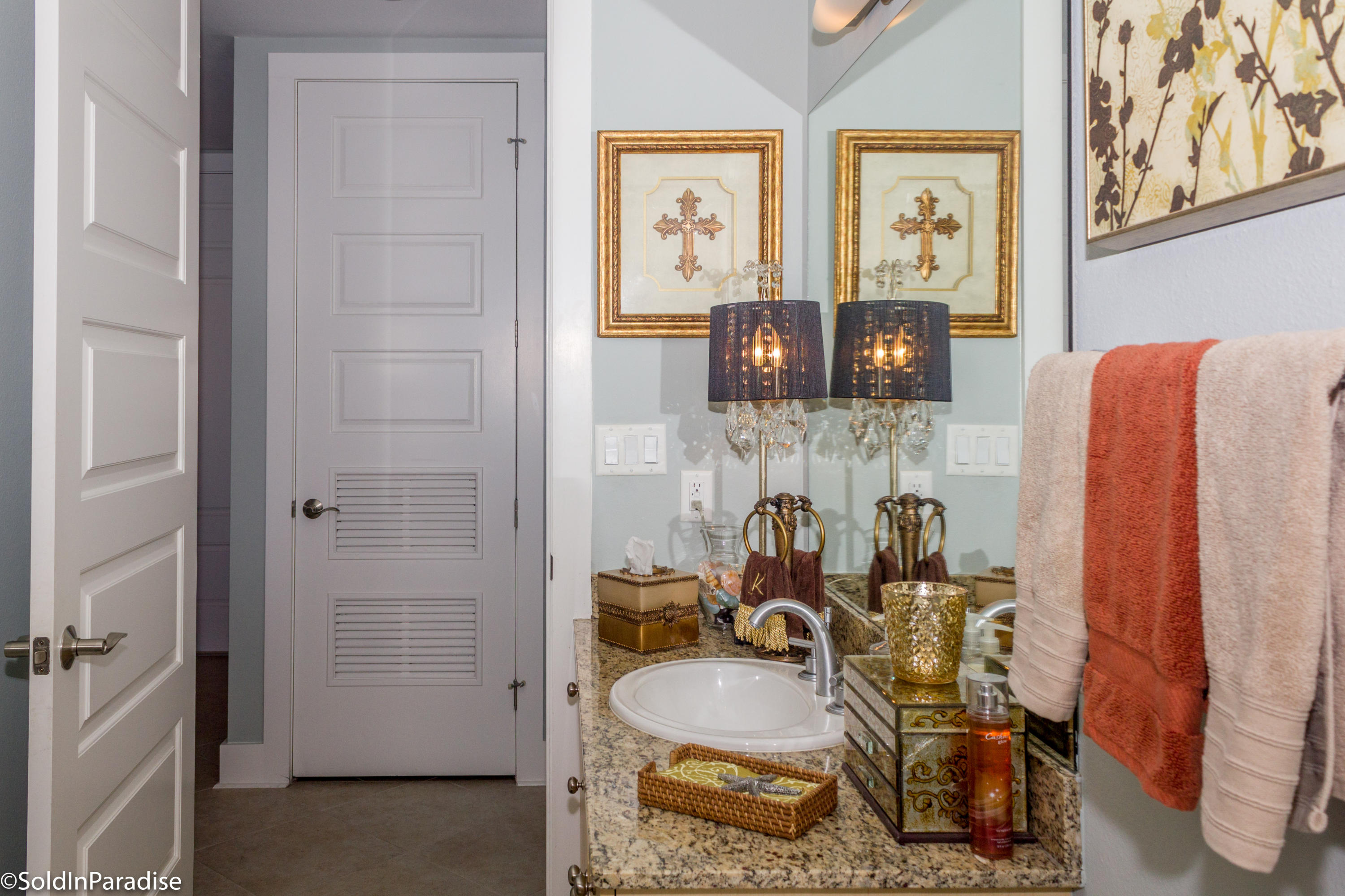 211 Durango Road, Unit 316 Destin, FL 32541 - Photo 28 of 48 a bathroom with a sink and mirror