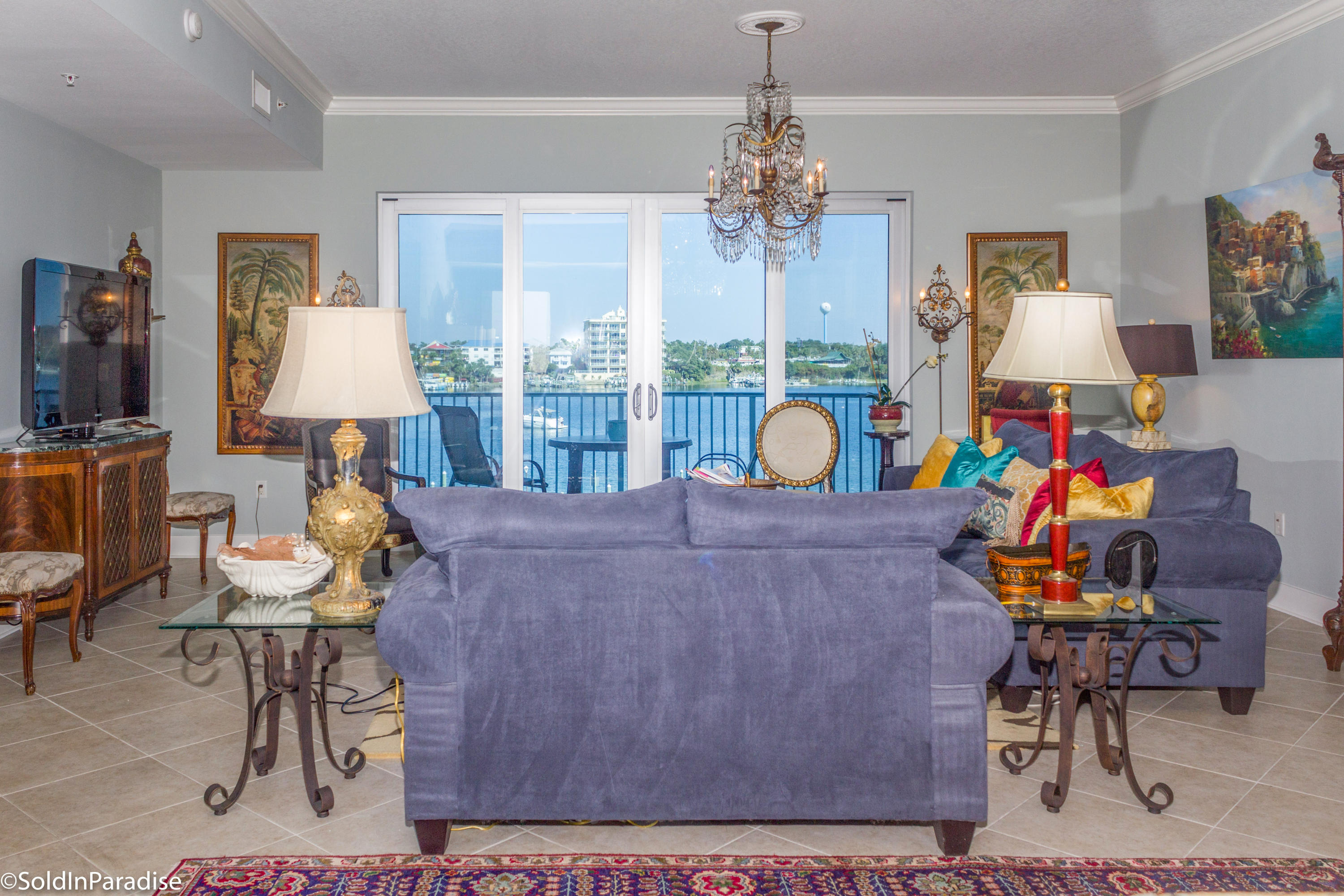 211 Durango Road, Unit 316 Destin, FL 32541 - Photo 3 of 48 a living room with furniture and a chandelier