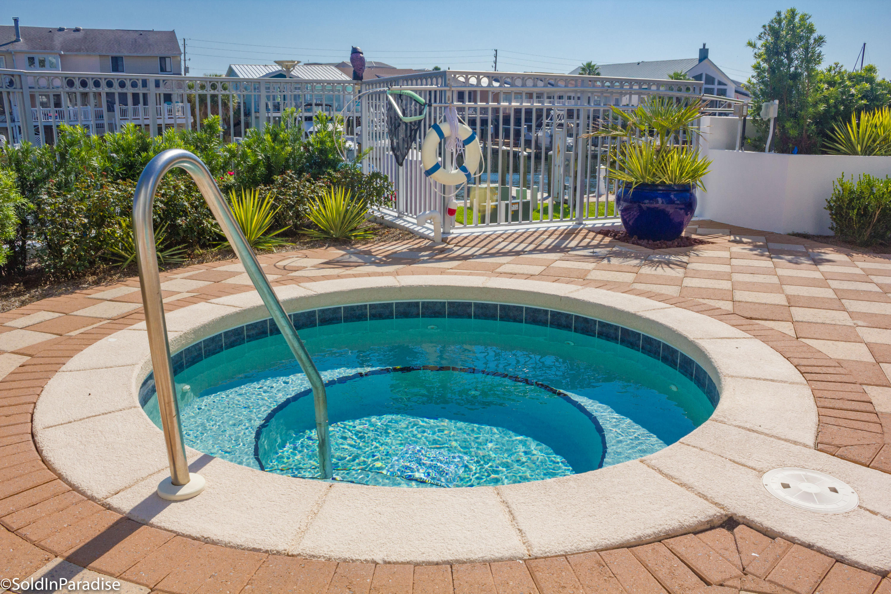 211 Durango Road, Unit 316 Destin, FL 32541 - Photo 31 of 48 a view of a swimming pool with a lounge chairs