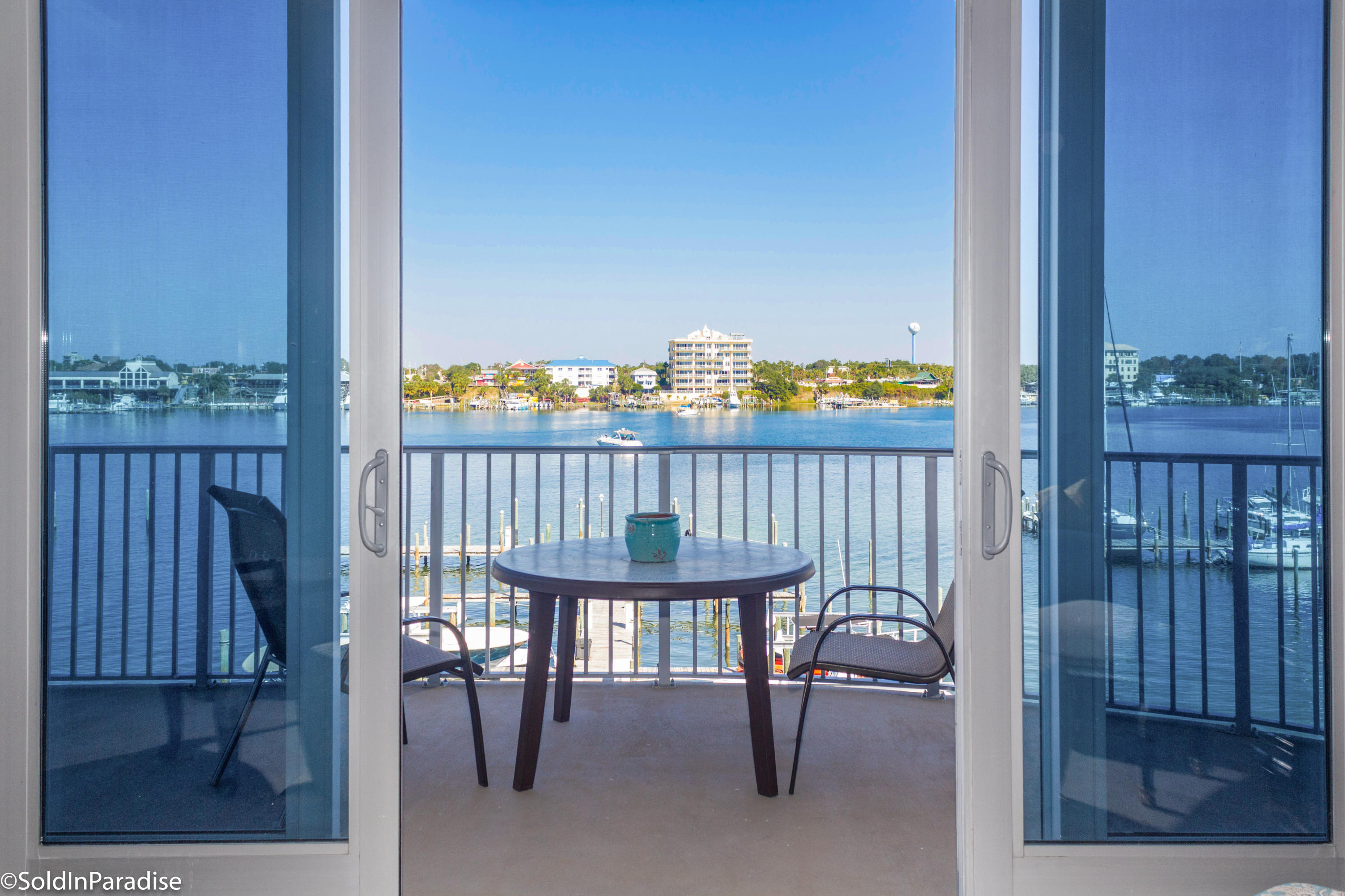 211 Durango Road, Unit 316 Destin, FL 32541 - Photo 4 of 48 a balcony with table and chairs