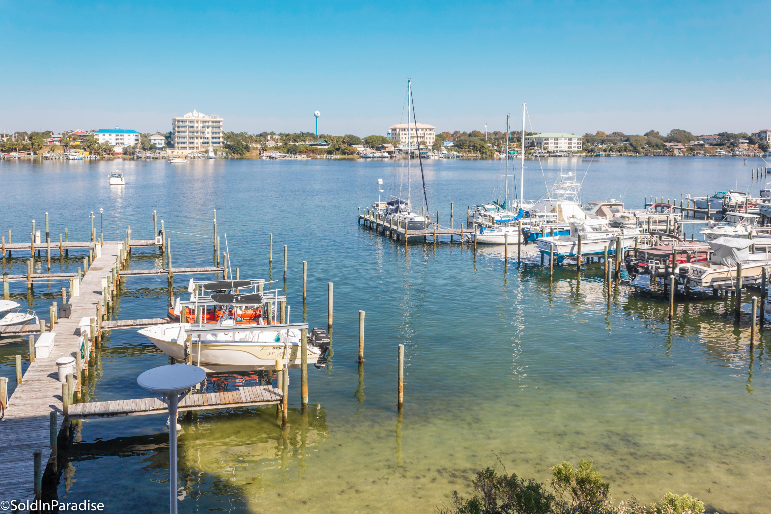 211 Durango Road, Unit 316 Destin, FL 32541 - Photo 7 of 48 a view of water with boats and trees in the background
