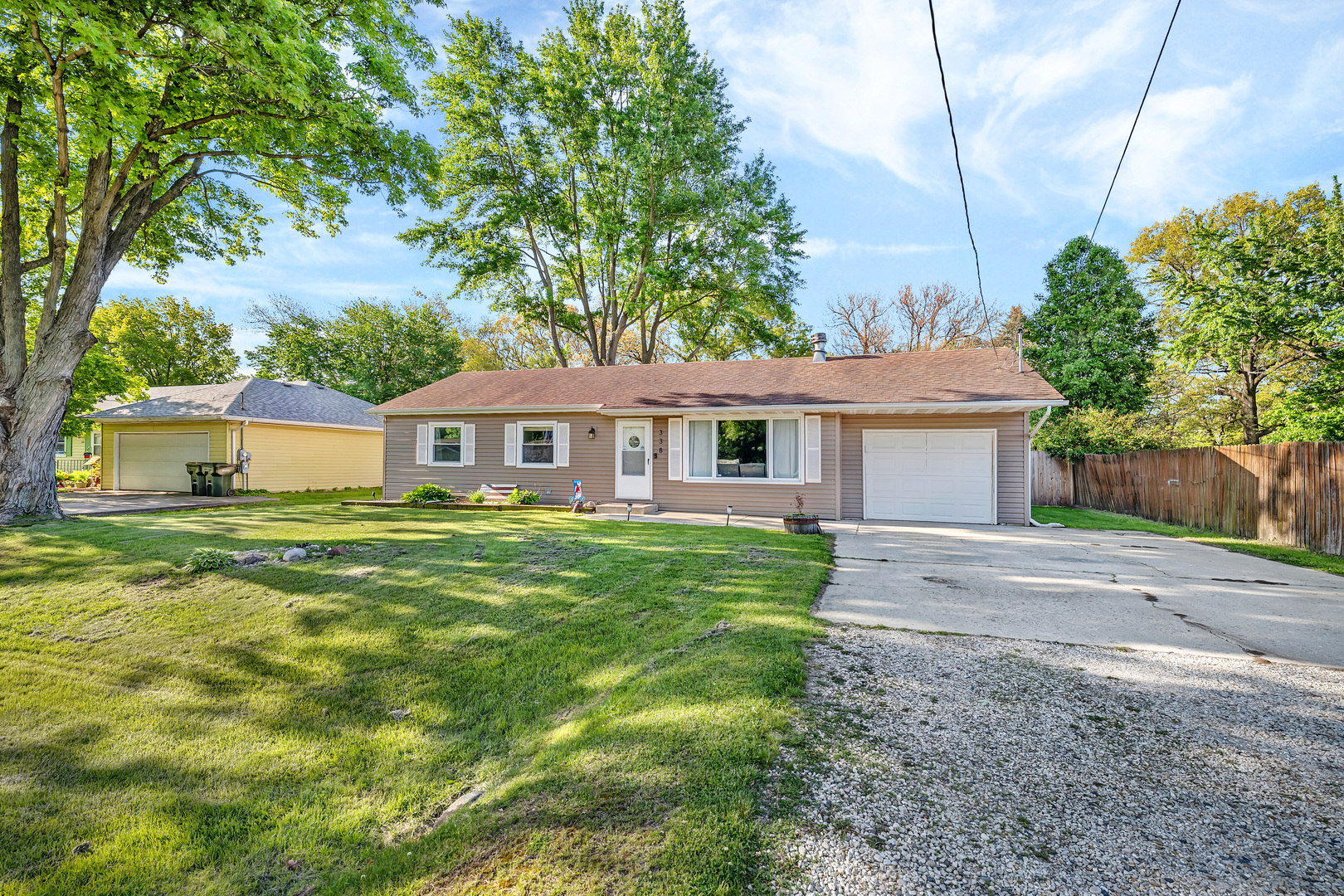 338 Orchard Lane Braidwood, IL 60408 - Photo 1 of 25 a front view of a house with a garden