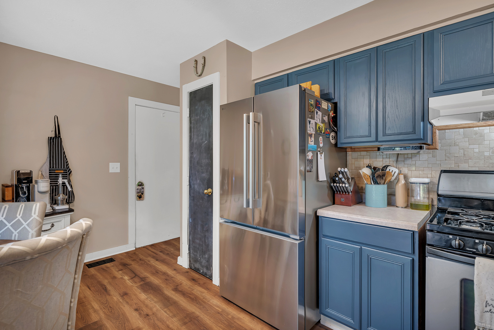 338 Orchard Lane Braidwood, IL 60408 - Photo 11 of 25 a kitchen with stainless steel appliances granite countertop a refrigerator stove and sink