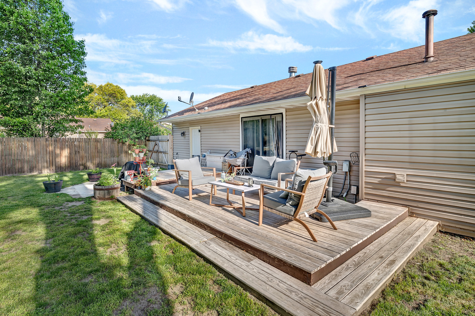 338 Orchard Lane Braidwood, IL 60408 - Photo 20 of 25 a view of a backyard with a patio and outdoor seating