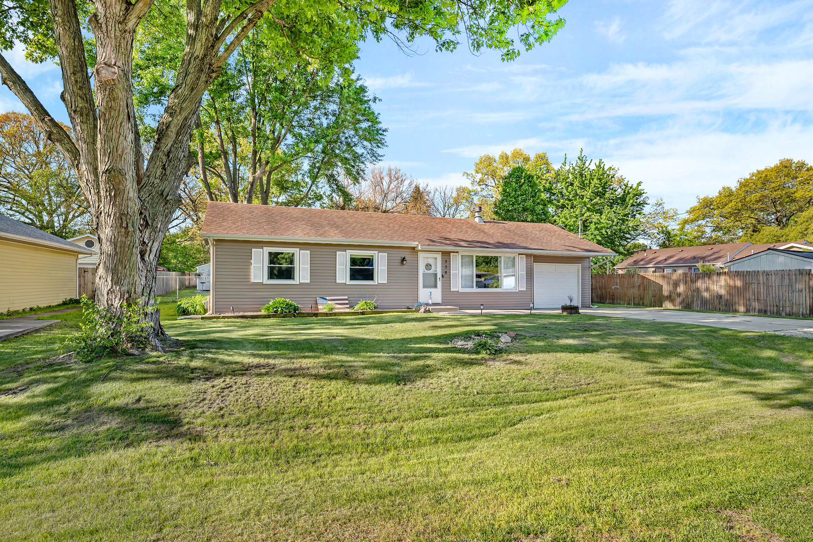 338 Orchard Lane Braidwood, IL 60408 - Photo 2 of 25 a front view of a house with a garden