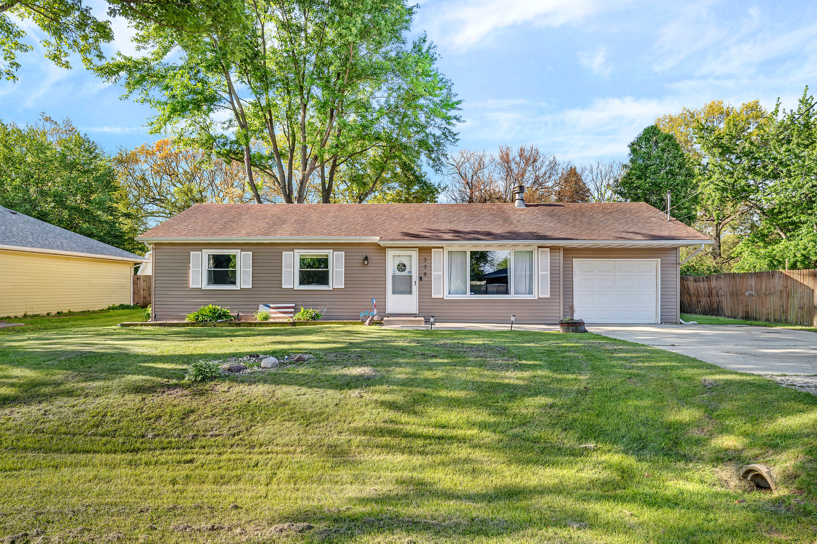 338 Orchard Lane Braidwood, IL 60408 - Photo 3 of 25 a front view of a house with a garden