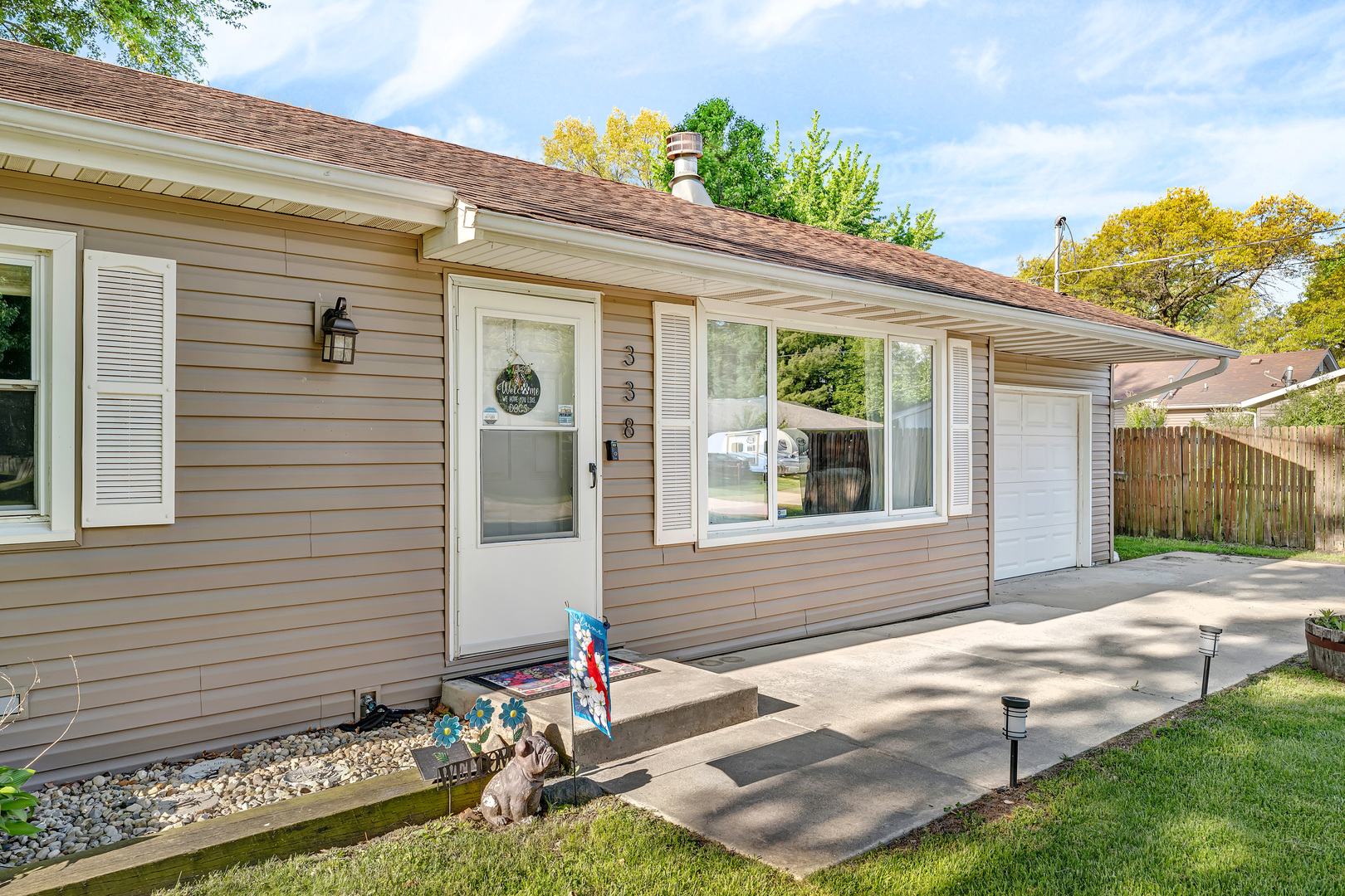338 Orchard Lane Braidwood, IL 60408 - Photo 4 of 25 a front view of a house with garden