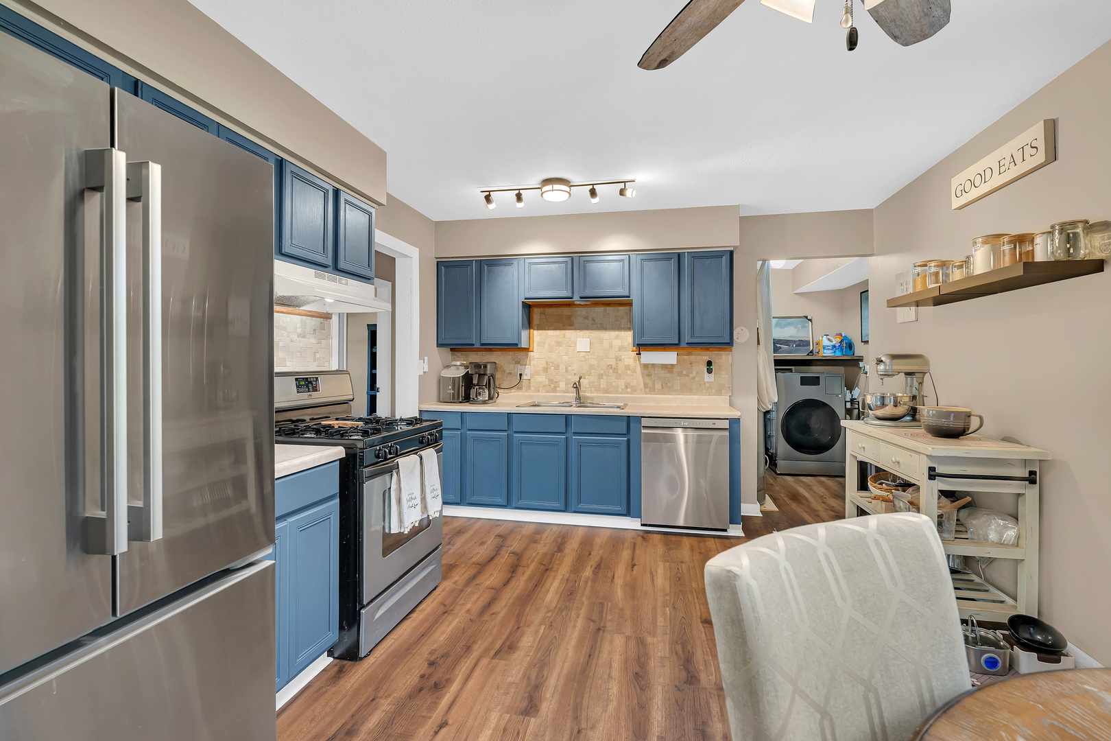 338 Orchard Lane Braidwood, IL 60408 - Photo 8 of 25 a kitchen with stainless steel appliances granite countertop a refrigerator a stove top oven a sink and dishwasher