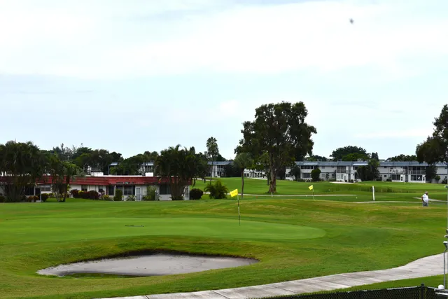 a view of grassy field with benches