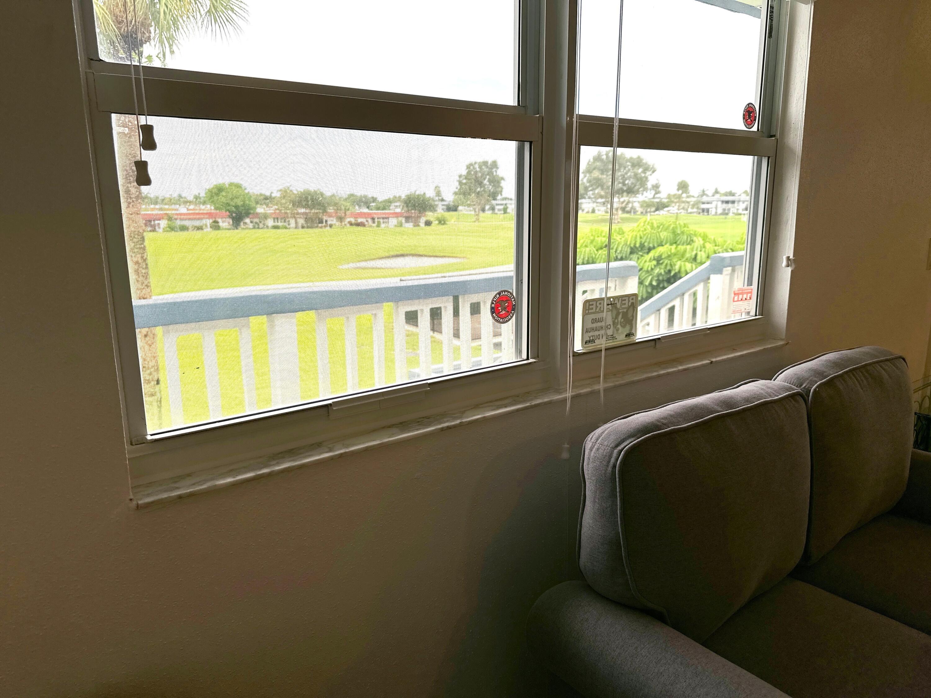 196 Tuscany C Delray Beach, FL 33446 - Photo 15 of 39 a living room with a large window