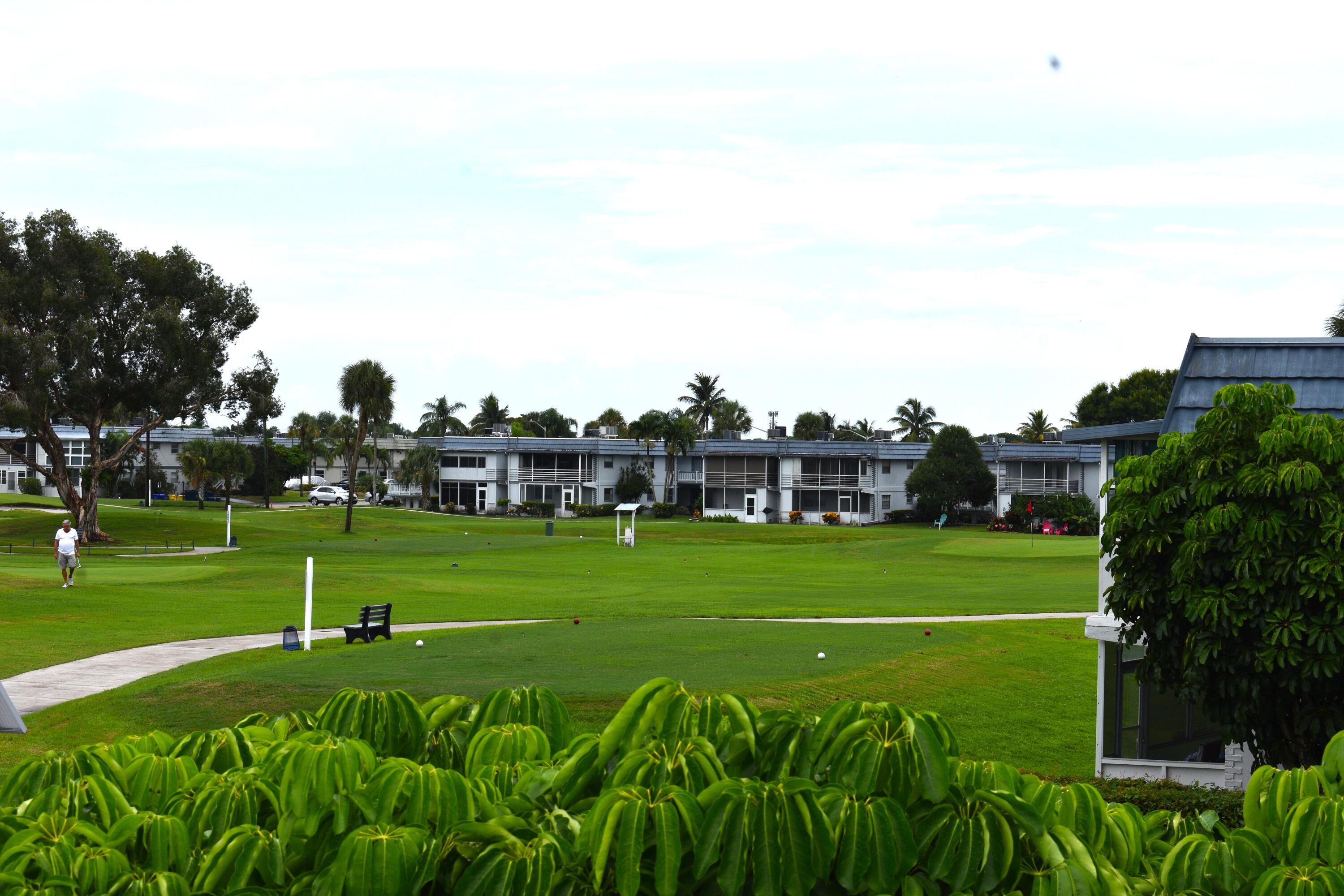 196 Tuscany C Delray Beach, FL 33446 - Photo 16 of 39 a green field with lots of trees