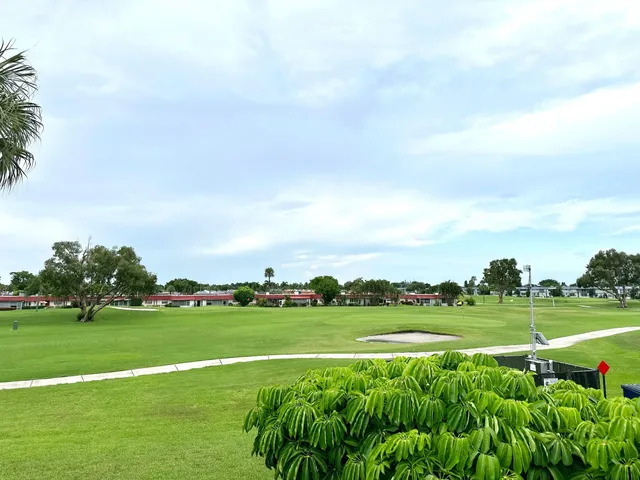 a view of a golf course with a garden