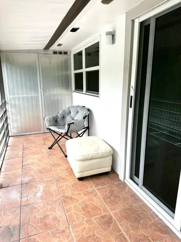 a living room with a couch and a rug floor