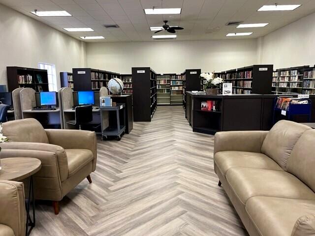 196 Tuscany C Delray Beach, FL 33446 - Photo 36 of 39 a living room with furniture and a flat screen tv