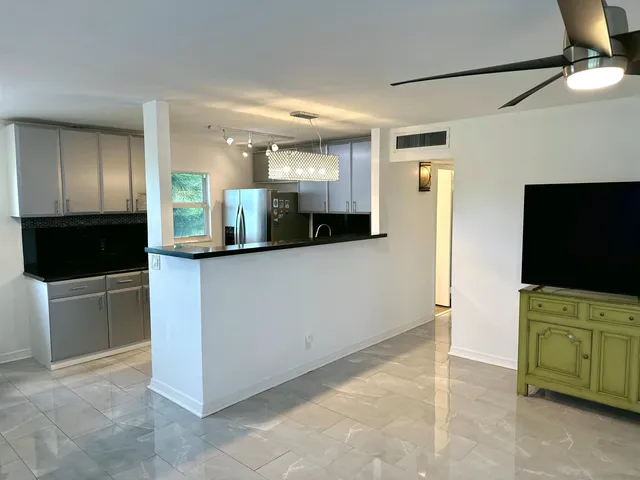 a view of a living room and a flat screen tv