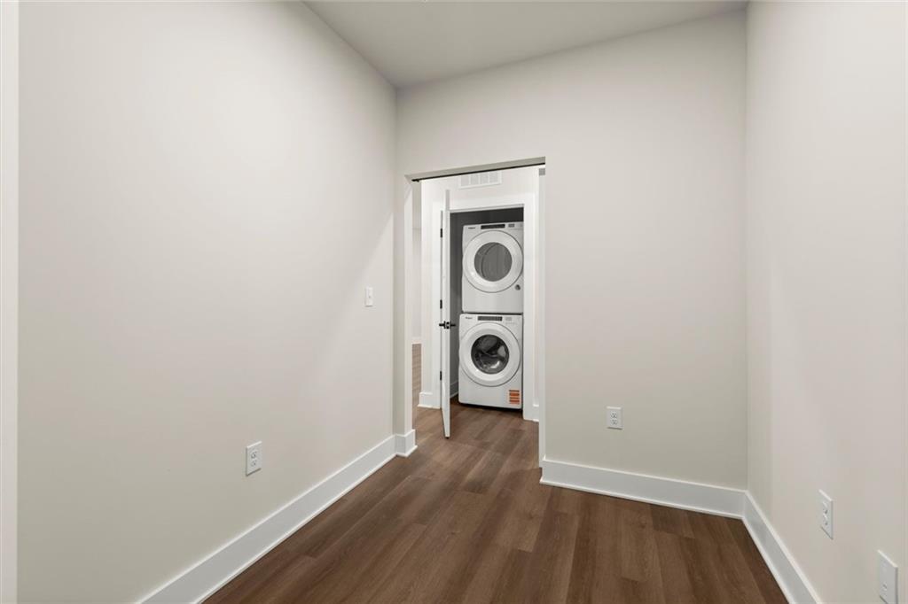 2648 Sandy Plains Road, Unit 422 Marietta, GA 30066 - Photo 15 of 37 a view of a hallway with wooden floor and closet