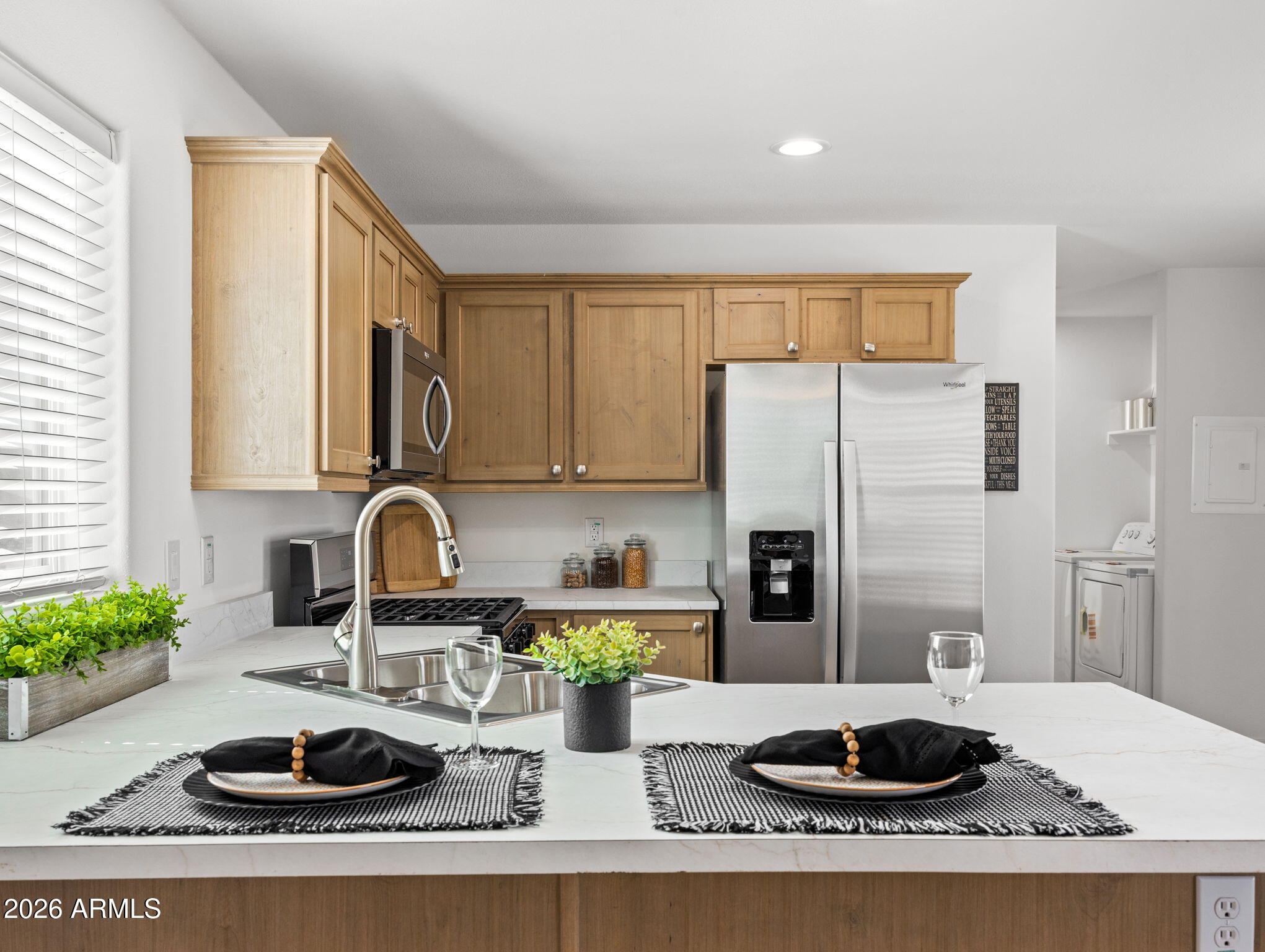 18296 Frontier Road Peeples Valley, AZ 86332 - Photo 1 of 44 a kitchen with a refrigerator and a sink