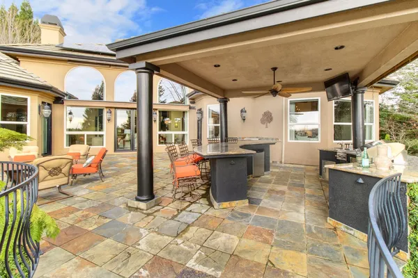 a view of an chairs and tables in the patio