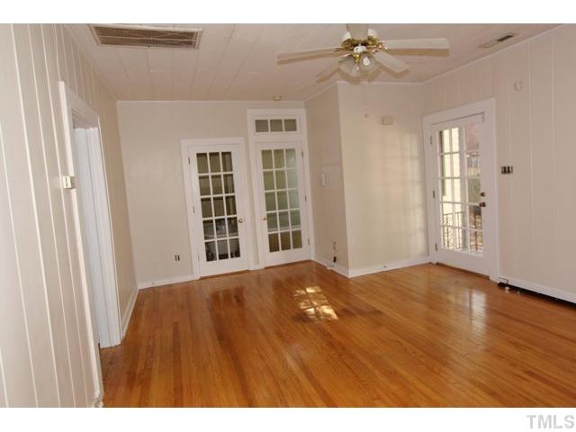 410 Chamberlain Street Raleigh, NC 27607 - Photo 3 of 14 a view of an empty room with a window