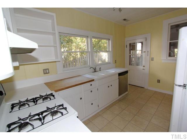 410 Chamberlain Street Raleigh, NC 27607 - Photo 4 of 14 a kitchen with a sink appliances and cabinets