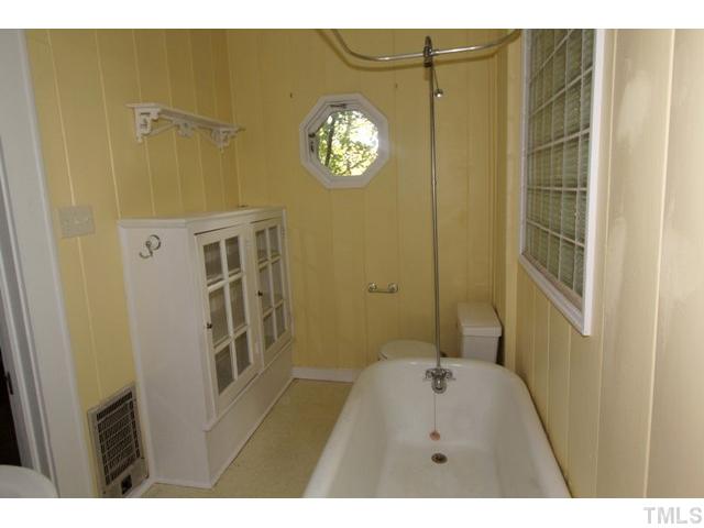 410 Chamberlain Street Raleigh, NC 27607 - Photo 9 of 14 a bathroom with a sink and a mirror