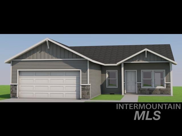 926 Latemar Road Jerome, ID 83338 - Photo 4 of 6 View of front of home featuring stone siding, board and batten siding, an attached garage, driveway, and a front yard