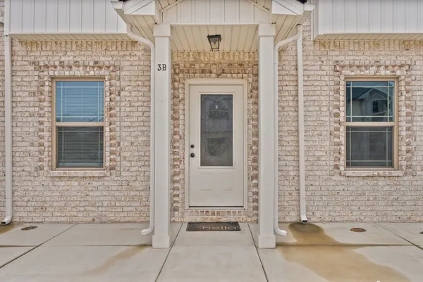 a front view of a house with a door