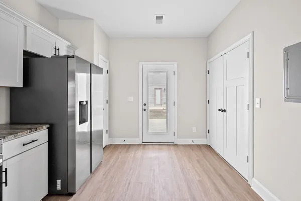 a view of a refrigerator in a kitchen