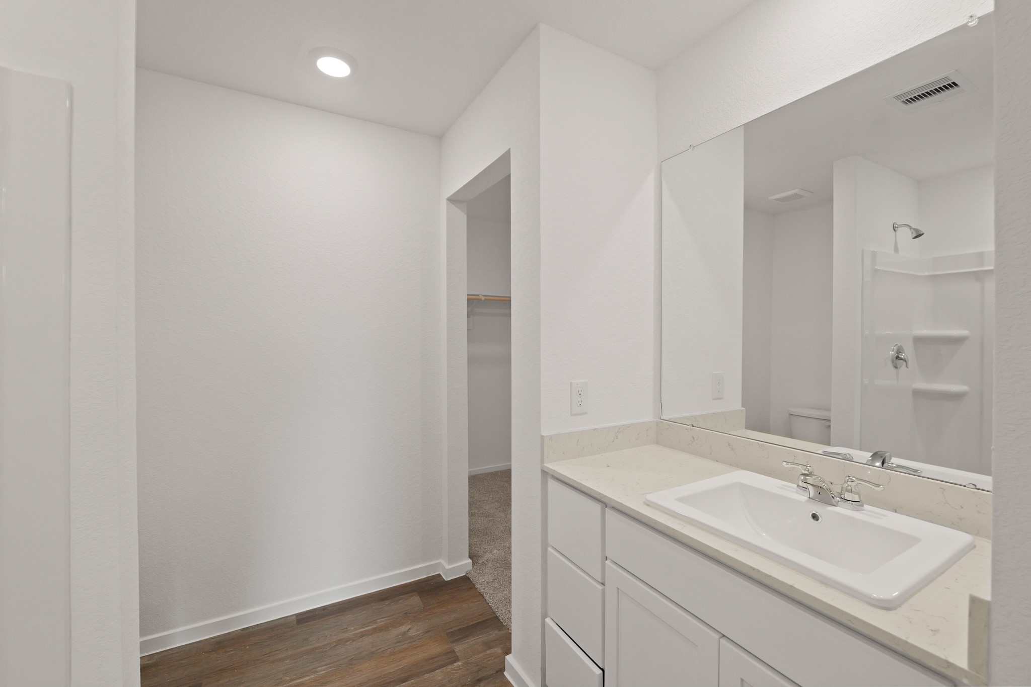20026 Fibonacci Street New Caney, TX 77357 - Photo 11 of 22 a bathroom with a sink and a mirror