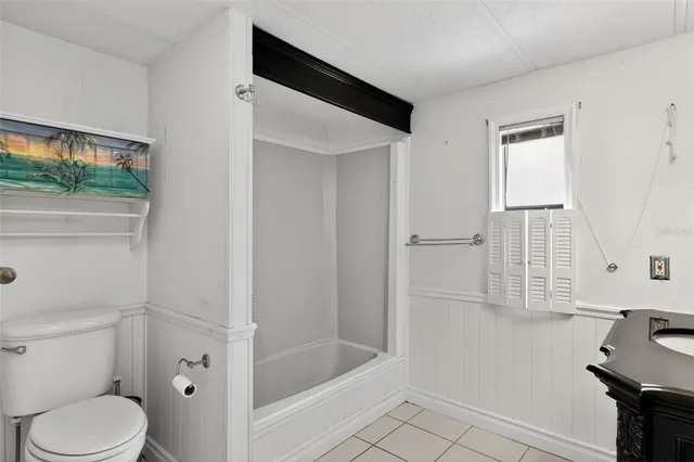 a bathroom with a sink vanity and a mirror