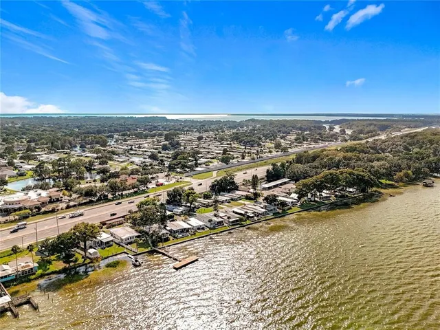 an aerial view of residential building and ocean