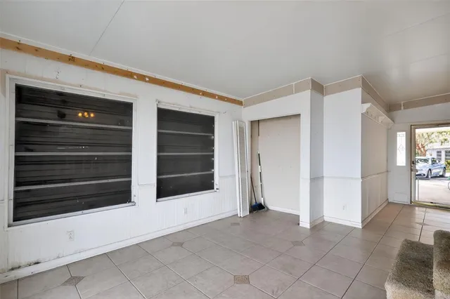 a view of a porch with wooden floor and stairs