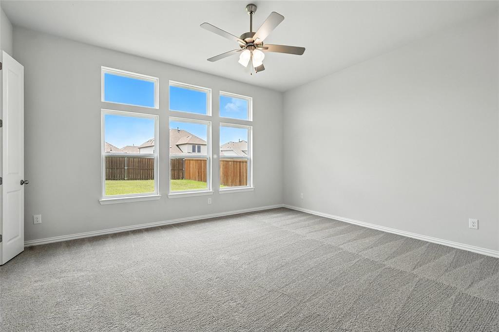 530 Red Barn Drive Van Alstyne, TX 75495 - Photo 15 of 40 Spare room featuring carpet and ceiling fan
